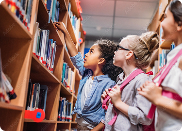 children picking books off a shelf