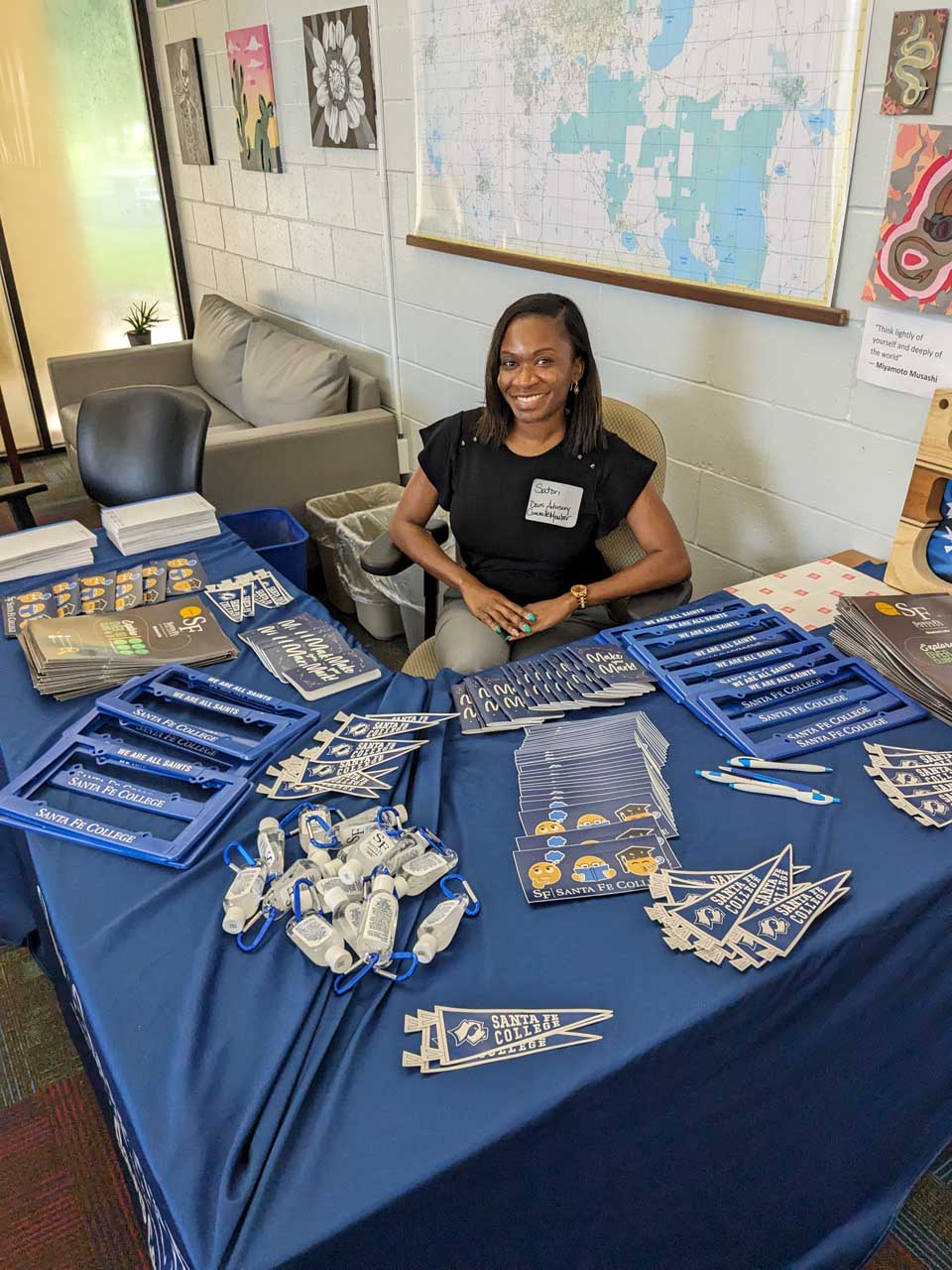 Image of Satori Days sitting at a booth in Sante Fe College