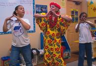 Foster Grandmother teaches hula