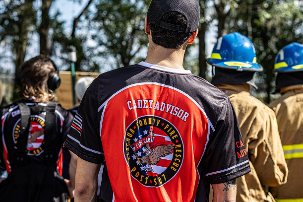 Image of cadets competing in a competition under the watchful eye of the cadet advisor