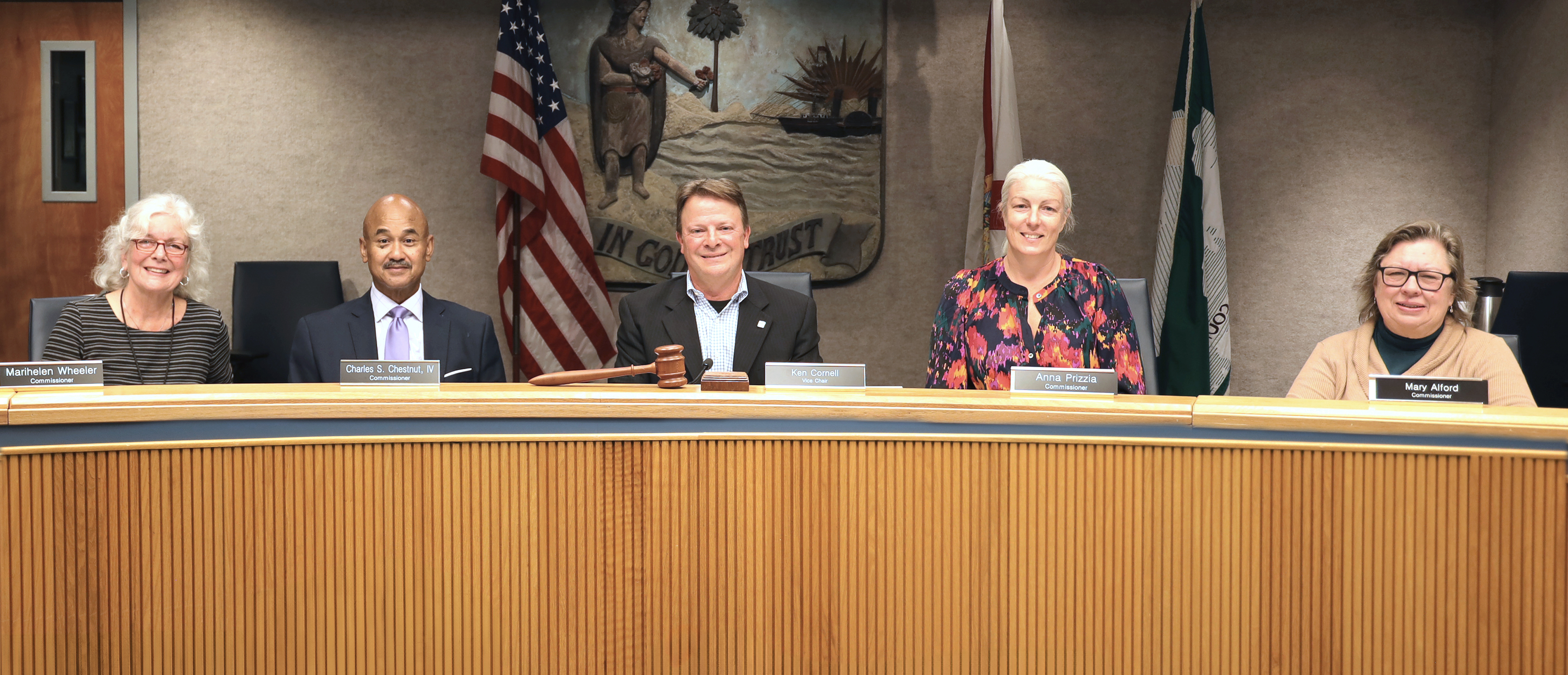The Alachua County Commission sitting at the dias
